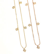Load image into Gallery viewer, Two Karina Chokers in 14k yellow gold with dangling mini diamond clovers laid flat on a white background.