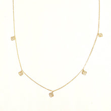 Load image into Gallery viewer, Karina Choker in 14k yellow gold with dangling mini diamond clovers laid flat on a white background.