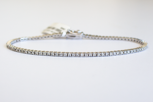 1.5 Carat Diamond Tennis Bracelet in white gold laid flat in a circle on a white background.