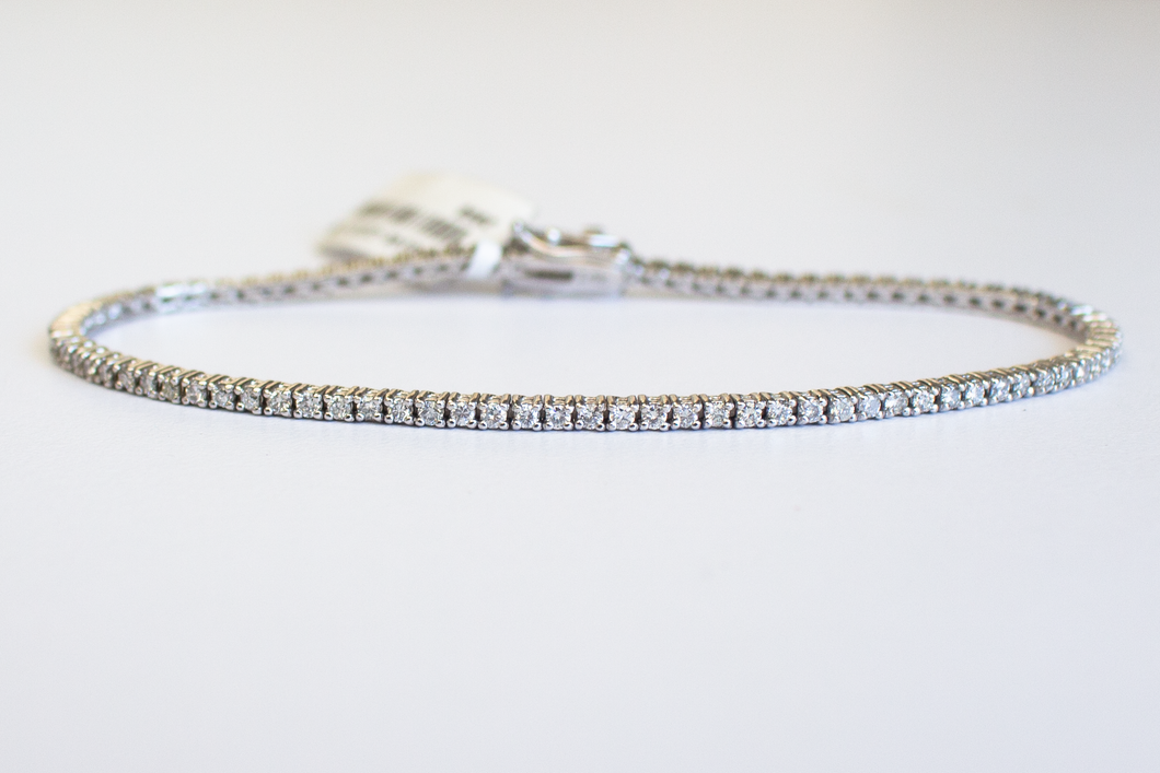 1.5 Carat Diamond Tennis Bracelet in white gold laid flat in a circle on a white background.