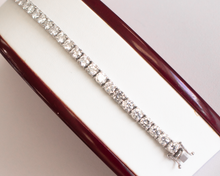 Load image into Gallery viewer, 13 Carat Diamond Tennis Bracelet in white gold laid flat in a box on a white background.
