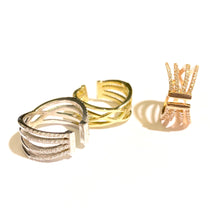 Load image into Gallery viewer, 14k Gold Reversible Corset Rings in white gold, yellow gold and rose gold laid flat on a white background.
