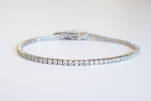 Load image into Gallery viewer, 3 Carat Diamond Tennis Bracelet in white gold laid flat in a circle on a white background.
