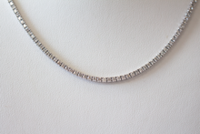 Load image into Gallery viewer, 6.25 Carat Diamond Tennis Necklace hanging on a white bust, close up.
