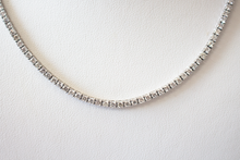 Load image into Gallery viewer, 7.5 Carat Diamond Tennis Necklace hanging on a white bust, close up.
