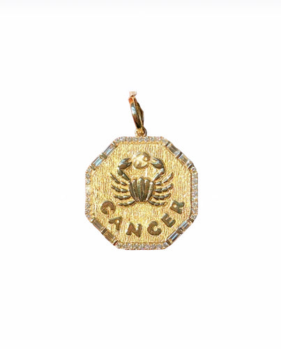 14k yellow gold Cancer Zodiac Charm surrounded by beautiful round and baguette diamonds on a white background.