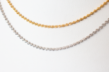 Load image into Gallery viewer, Cassie Genuine 14 karat gold diamond cut beaded choker in yellow gold and white gold laid flat on a white background.
