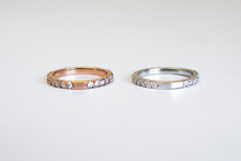 Load image into Gallery viewer, Two Classic 14k Diamond Band in white gold and yellow gold laid flat next to each other on a white background.
