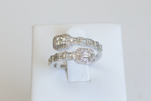 Load image into Gallery viewer, Diamond Baguette Wrap Ring in white gold displayed on a ring stand on a white background.

