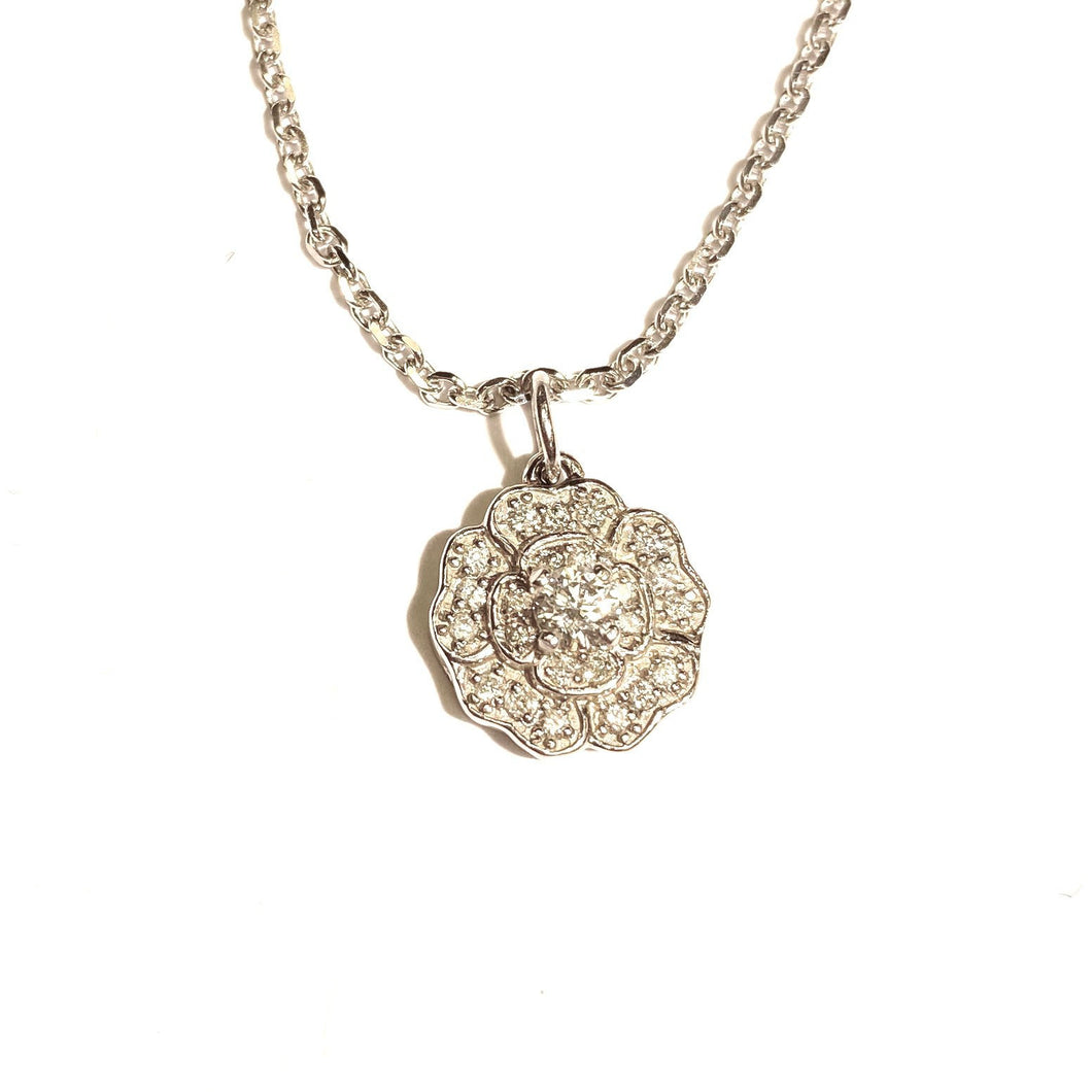 Diamond Blossom Necklace in 14k Gold laid flat on a white background.