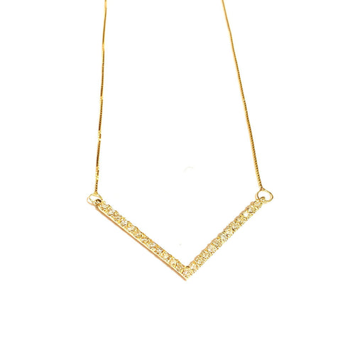 Diamond V Necklace in 14k Yellow Gold laid flat on a white background.