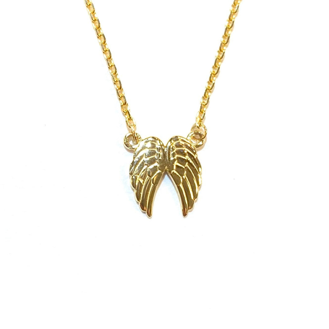 Close up of Double Angel Necklace in 14K yellow Gold on a white background.
