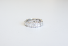 Load image into Gallery viewer, Straight on view Emerald Cut Diamond Illusion Band on a white background.
