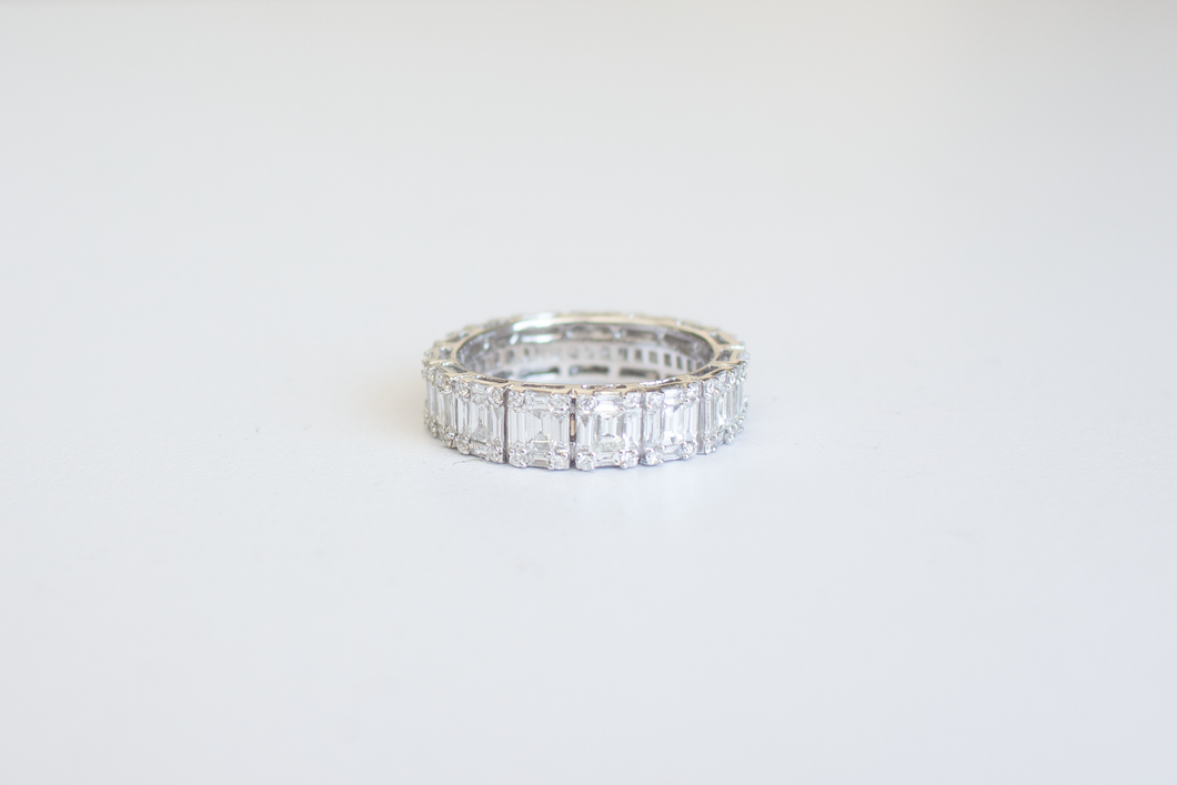 Straight on view Emerald Cut Diamond Illusion Band on a white background.