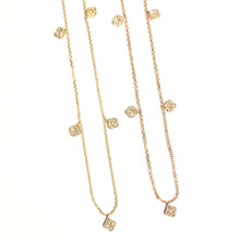 Load image into Gallery viewer, Two Karina Chokers in 14k yellow gold with dangling mini diamond clovers laid flat on a white background.
