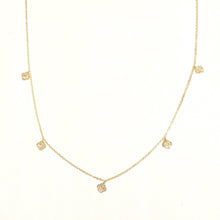 Load image into Gallery viewer, Karina Choker in 14k yellow gold with dangling mini diamond clovers laid flat on a white background.
