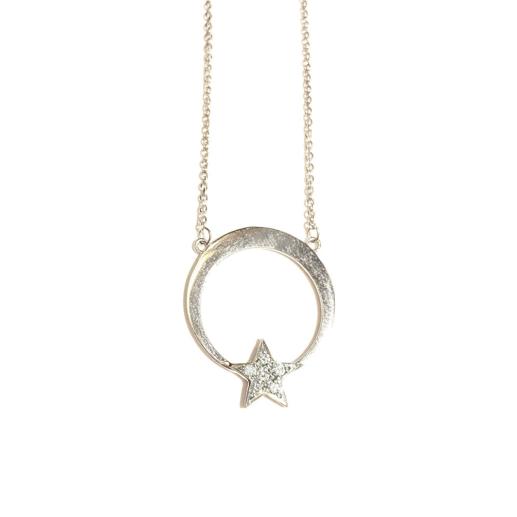 Moon and Diamond Star necklace in 14K White Gold laid flat on a white background.