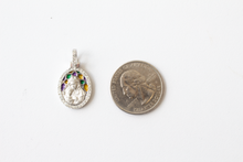 Load image into Gallery viewer, Stained Glass Mary and Jesus Pendant in 14k White Gold and a quarter laid flat on a white background.
