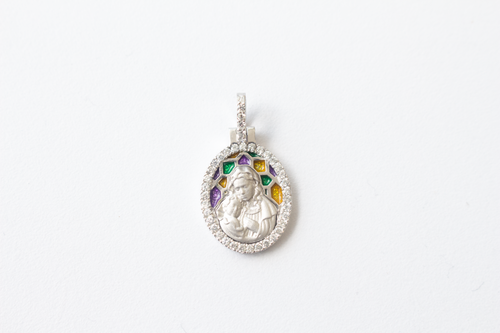Stained Glass Mary and Jesus Pendant in 14k White Gold laid flat on a white background.