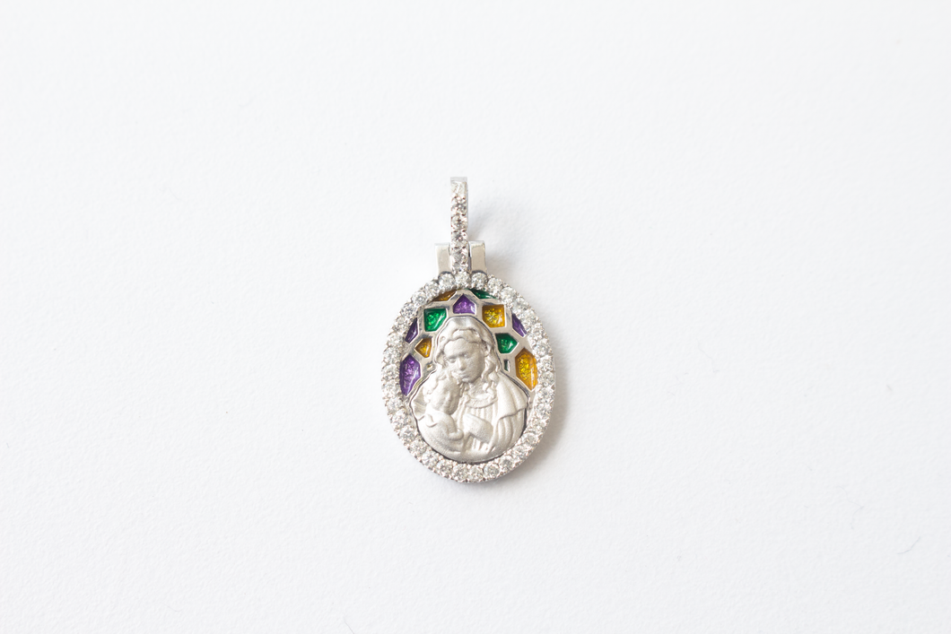 Stained Glass Mary and Jesus Pendant in 14k White Gold laid flat on a white background.